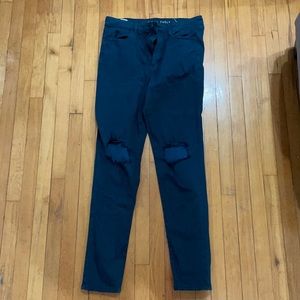 Dark green American eagle pants with holes in knees